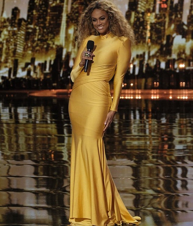 Tyra Banks flaunts her flawless figure in stunning gold gown as she storms the red carpet for America’s Got Talent’s first live show (Photos)