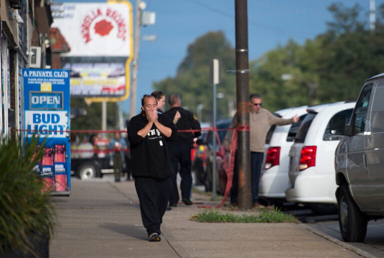 Breaking news: One suspect nabbed, one sought in shooting rampage that killed 4, wounded 5 in Kansas bar