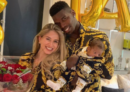 footballer paul pogba shows off his sons face for the first time see photos