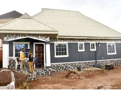 from grass to grace comedian mc gbovo builds a multi million naira house for his mother photos