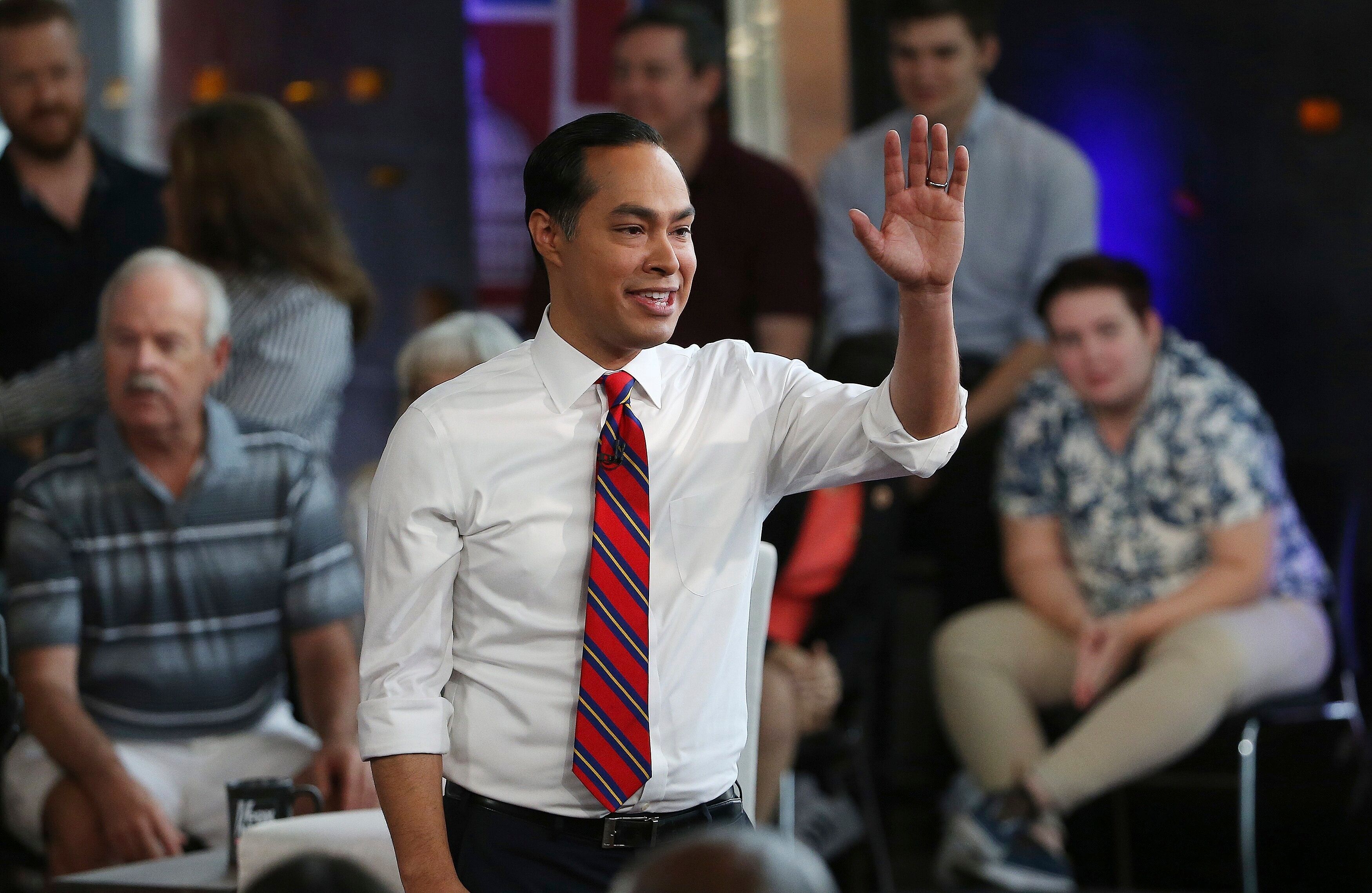 Juli&aacute;n Castro waves to the crowd after a town hall event in June.