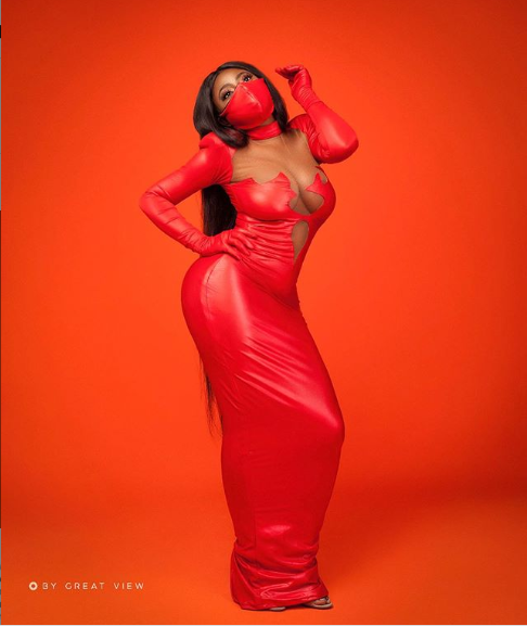 actress yvonne jegede stuns in cleavage baring latex dress with matching nose masks photos 2