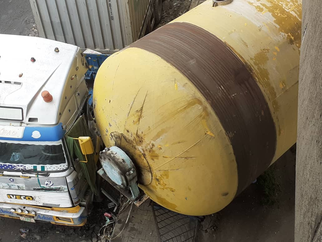 tragedy averted as gas tank detaches from a moving truck and falls off the bridge in ijora photos 2