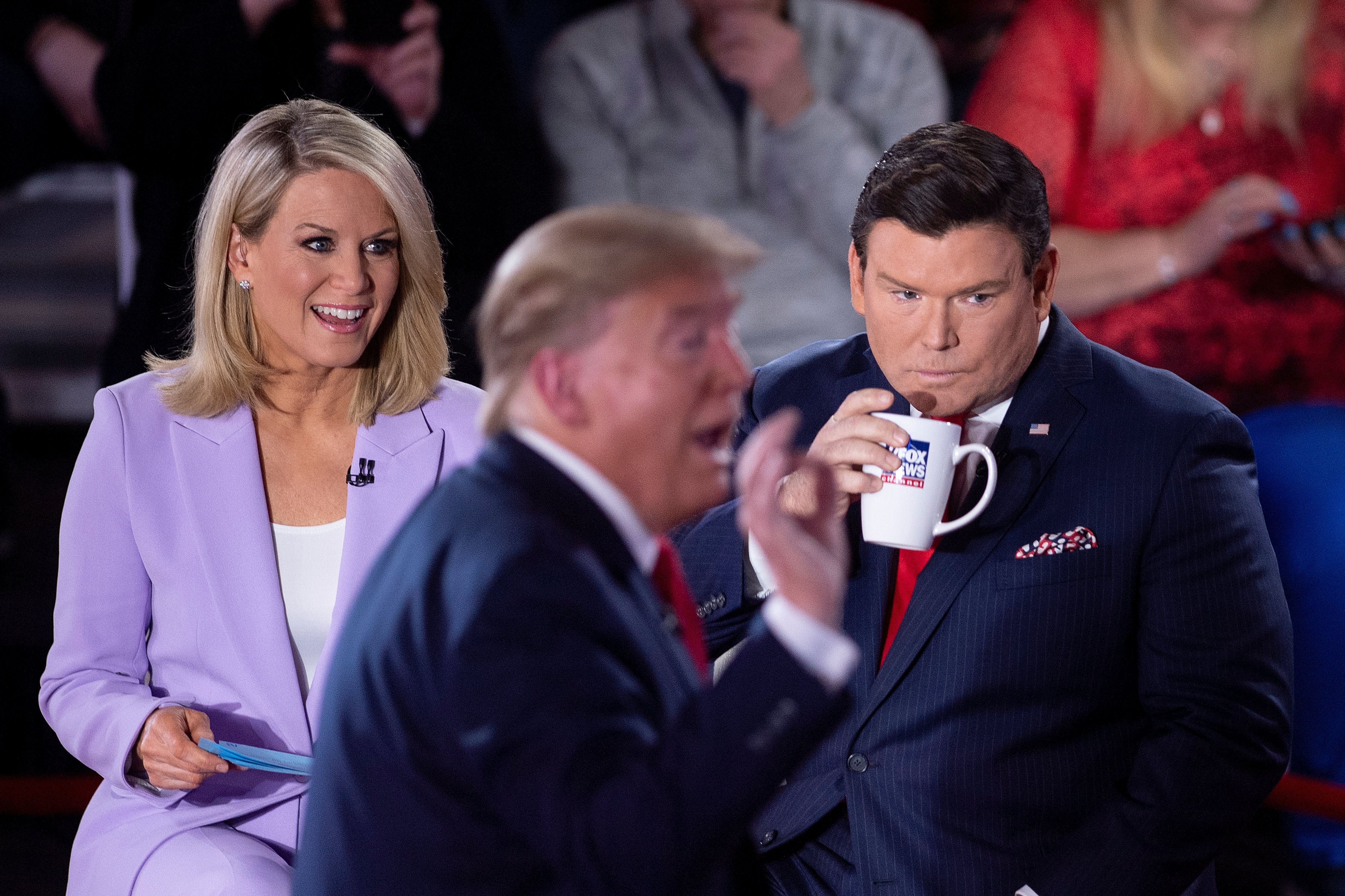 Fox News anchors Martha MacCallum and Bret Baier, pictured in March with Donald Trump, have been asked to quarantine, accordi