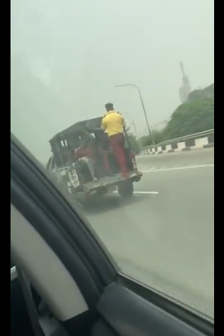 LASTMA official called out for breaking the law by standing at the back of a moving truck 