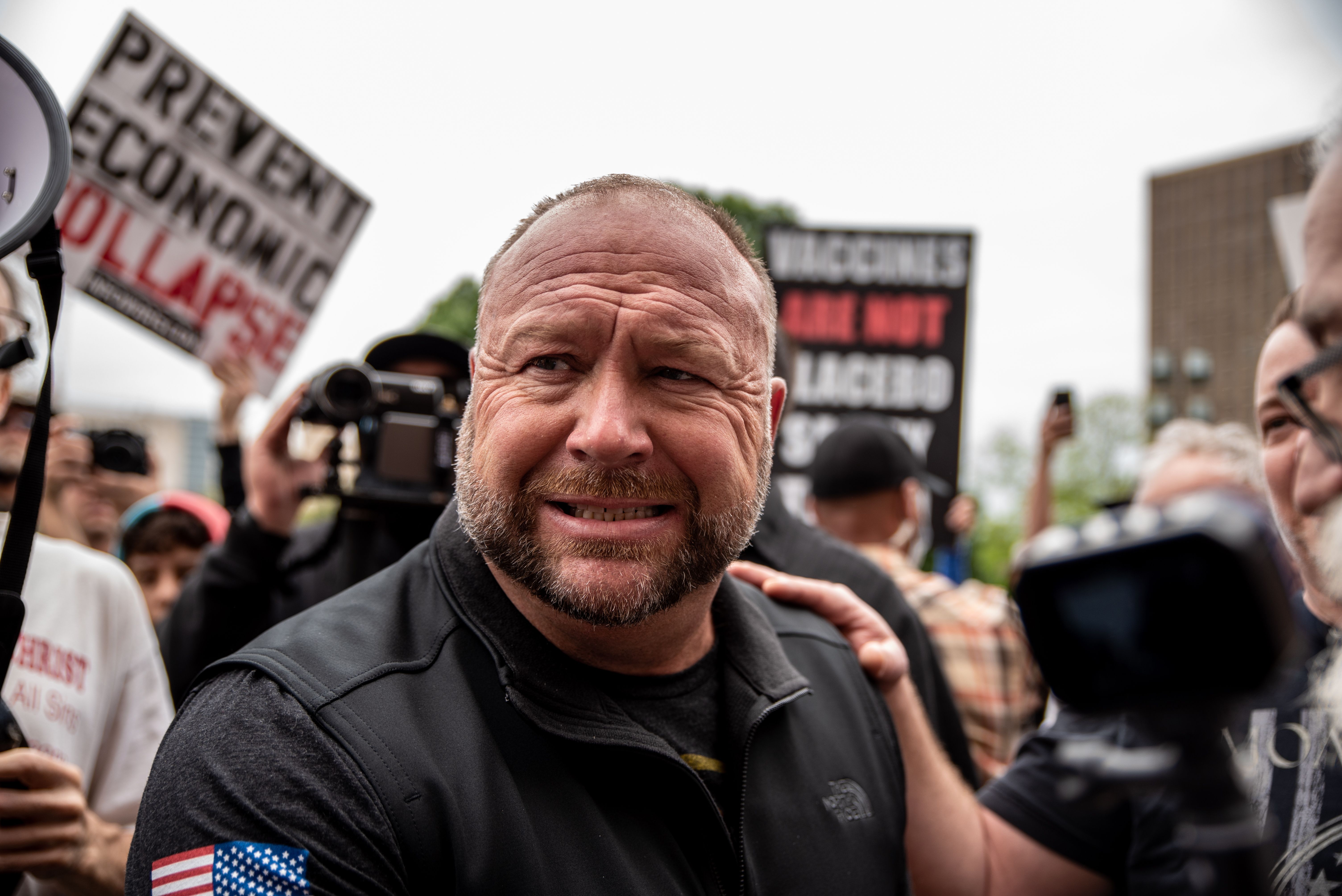 Alex Jones has been pictured over the past year at protests calling for the country to be opened up despite the COVID-19 pand