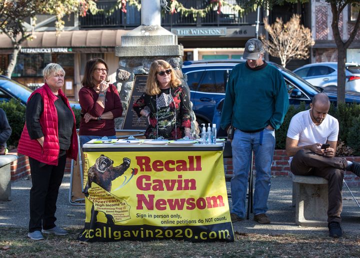 People circulate a "Recall Gavin Newsom" petition in Solvang, California, during a pro-Donald Trump rally.&nbsp;