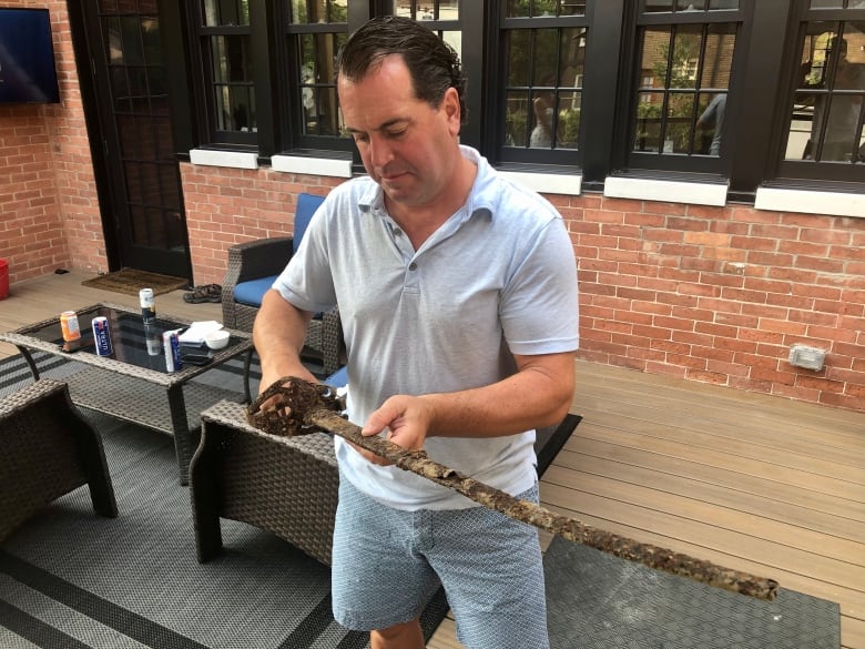 Ottawa family has mystery on its hands after sword unearthed in backyard by contractors