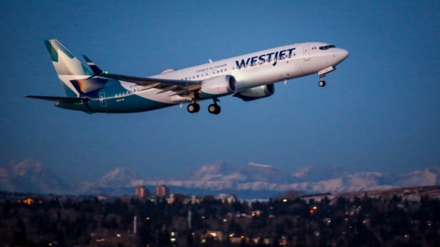 westjet cuts 20 per cent of flights in march calls for reopening timeline