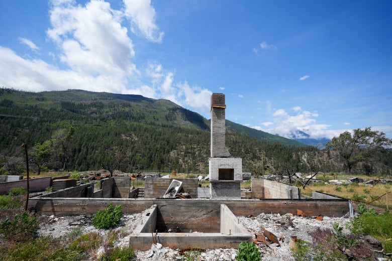 A chimney and foundation from what was once a home are all that is left after a wildfire tore through the town of Lytton, B.C.