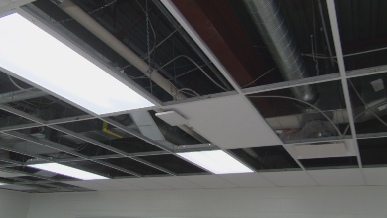 The ventilation system of a building within the ceiling.