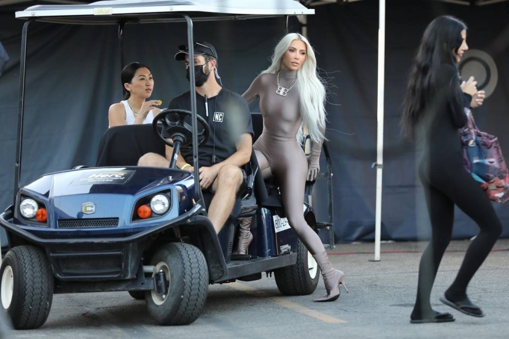 Kim Kardashian – In a skin-tight steel colored ensemble shoots a commercial for Hulu in LA
