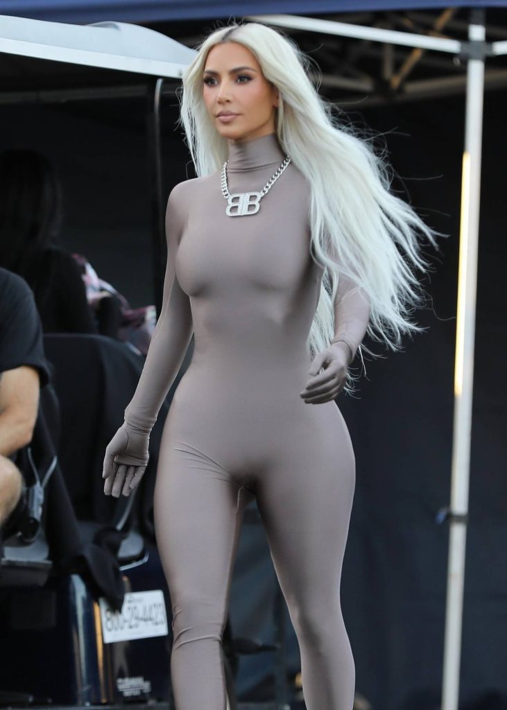 Kim Kardashian – In a skin-tight steel colored ensemble shoots a commercial for Hulu in LA