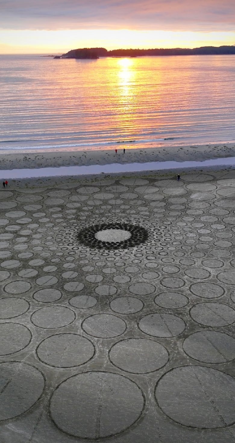 renowned sand artist up against the clock as tide threatens massive installation in tofino b c 4