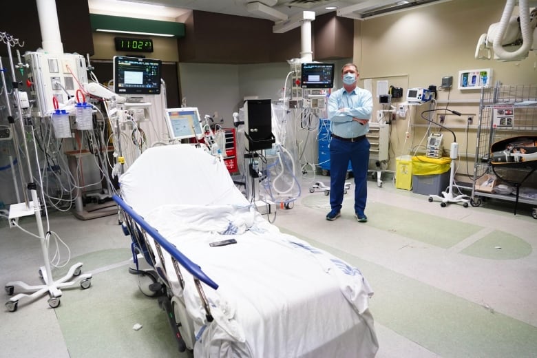 Man stands in front of emergency room equipment
