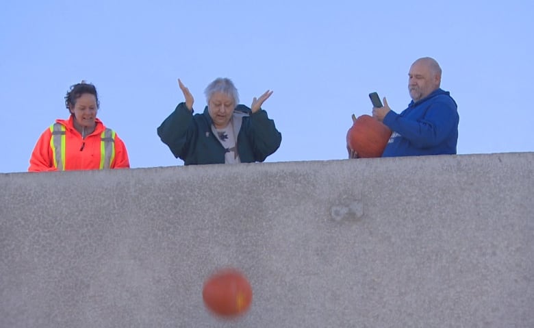 smashing pumpkins winnipeggers toss their halloween gourds to help stem climate change