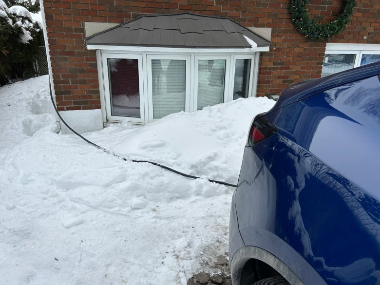 Electric car plugged into house