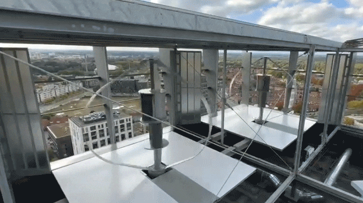 An animated gif of a pair of PowerNest wind turbines.