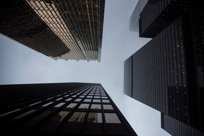 A file photo, from June 2018, looking up at some office towers in Toronto's financial district.