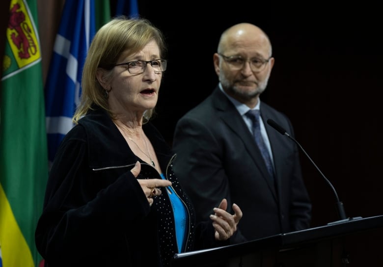 Minister of Justice and Attorney General of Canada David Lametti looks on as Susan Milgaard, sister of wrongfully convicted David Milgaard, speaks during a news conference on Parliament Hill, Thursday in Ottawa. 