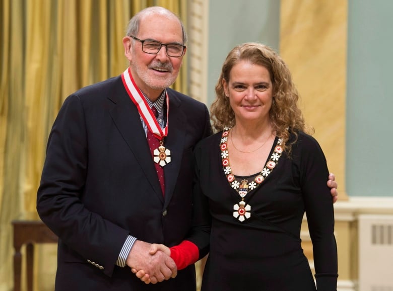 Governor General Julie Payette promotes Peter Herrndorf, of Ottawa, to Companion of the Order of Canada during a ceremony at Rideau Hall, Wednesday, January 24, 2018 in Ottawa. THE CANADIAN PRESS/Adrian Wyld