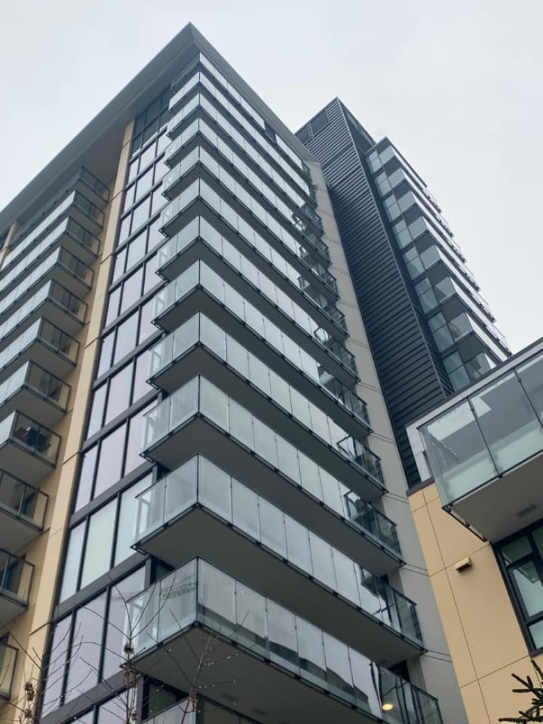 A glass panel is missing from the 15th-floor of a condo building.
