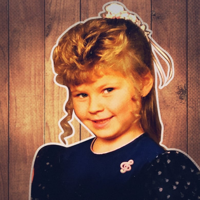 Childhood photo of Victoria Gibson in a navy dress.
