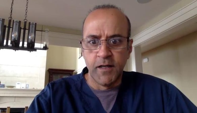 Dr. Arun Abbi looks directly at the camera
