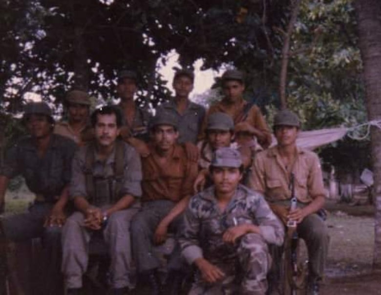 Federico Aguado Matuz, second from left, fought joined the military to fight for his country and the revolution. He says that dream is long dead. 