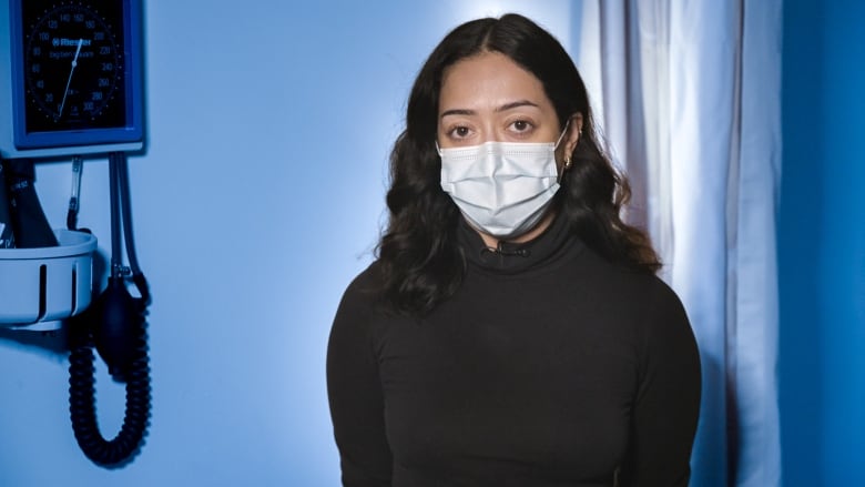 Photo of nurse Monica Naddafi wearing a surgical mask.