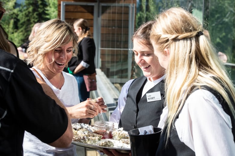 Servers are pictured at a Banff Centre event in 2019.