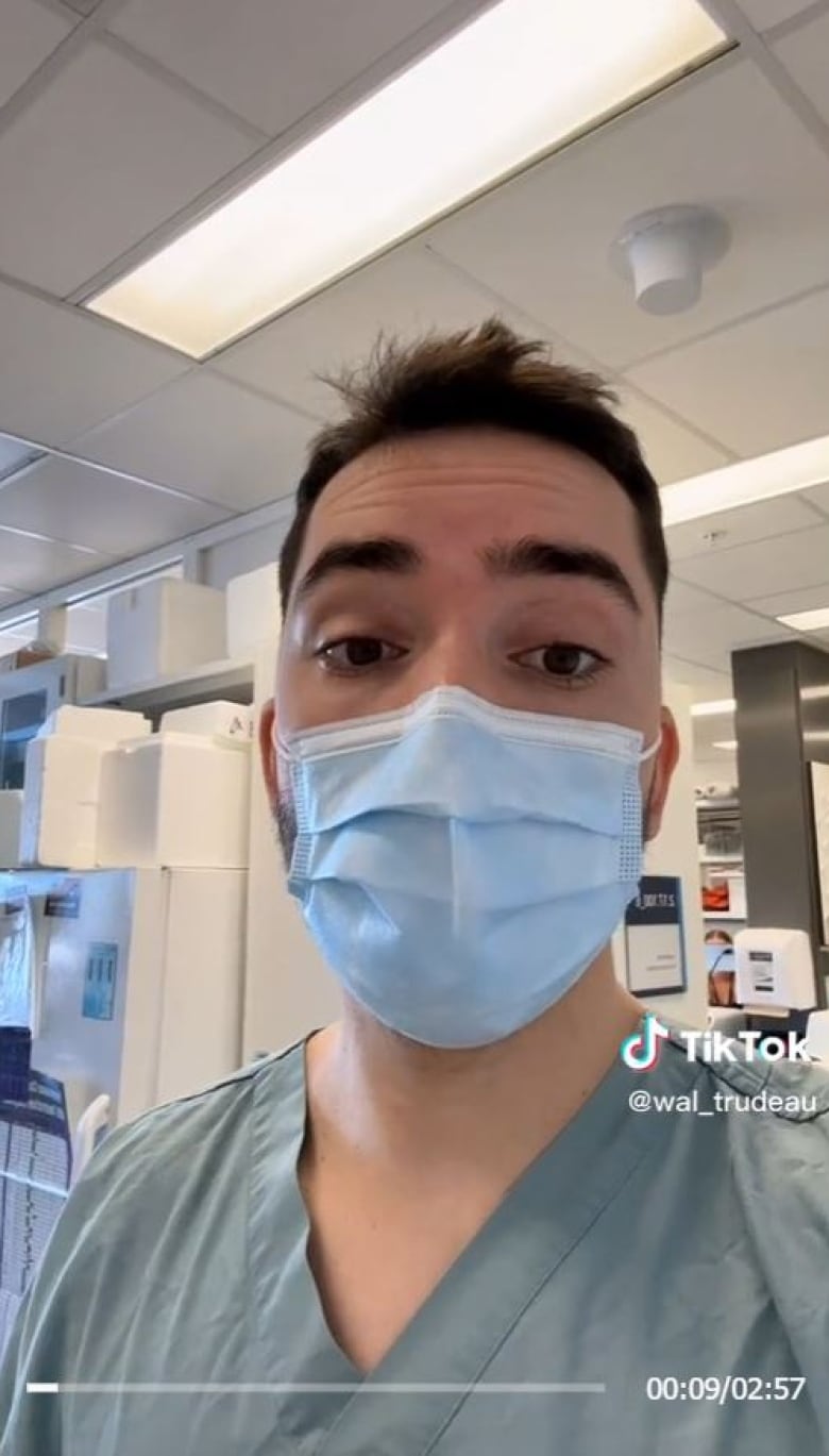A man wearing a mask speaks to the camera in a screengrab from TikTok. 