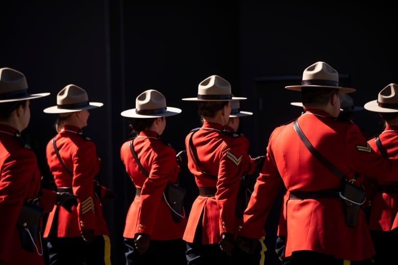 RCMP members are pictured wearing their red serge uniforms during a Change of Command ceremony in Langley, British Columbia on Tuesday, September 20, 2022. 