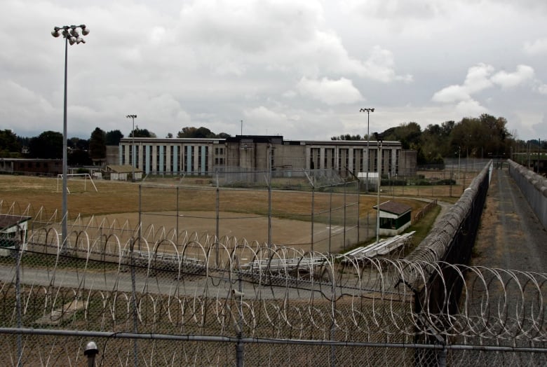 A prison is seen on a cloudy day.