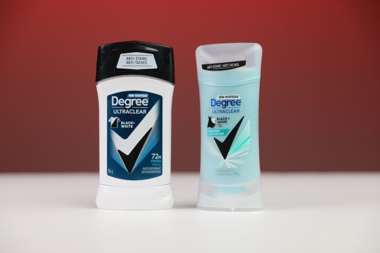 Left, a boxy black and white container of deodorant with a black and white t-shirt on it. Right is a curvy container of deodorant that is a light blue colour with the image of a dress.