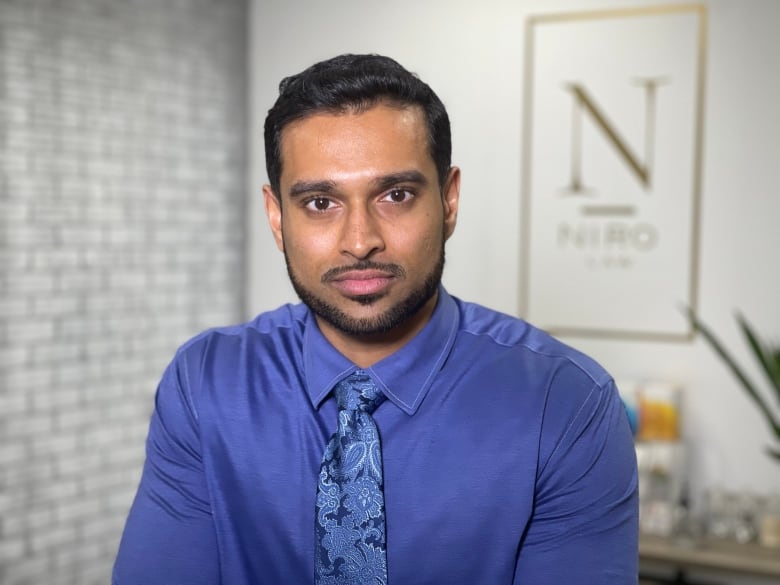 A headshot of Niroosan "Niro" Vivekanantharajah, a Toronto-based real estate lawyer