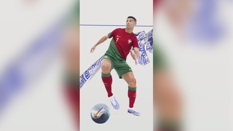 Cristiano Ronaldo is wearing a red and green Portugal jersey while chasing a soccer ball in the blue and white Nike soccer cleats. 