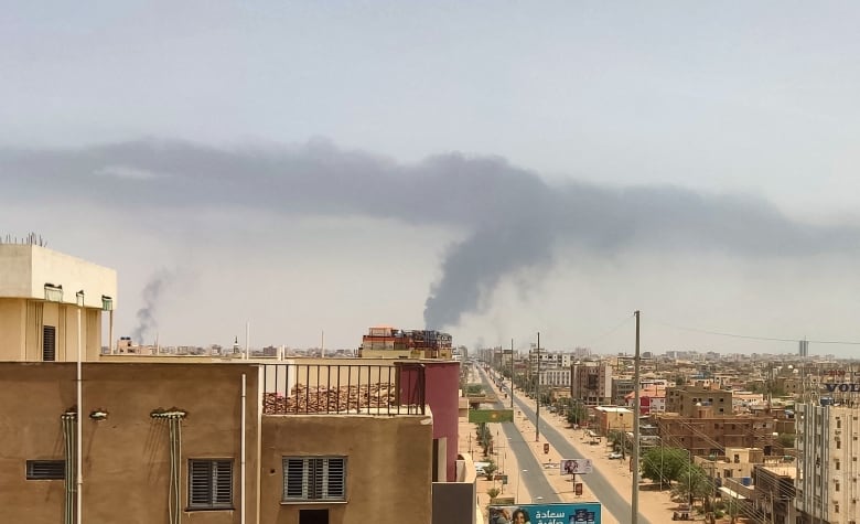 Smoke is seen rising Friday from an area east of Khartoum.