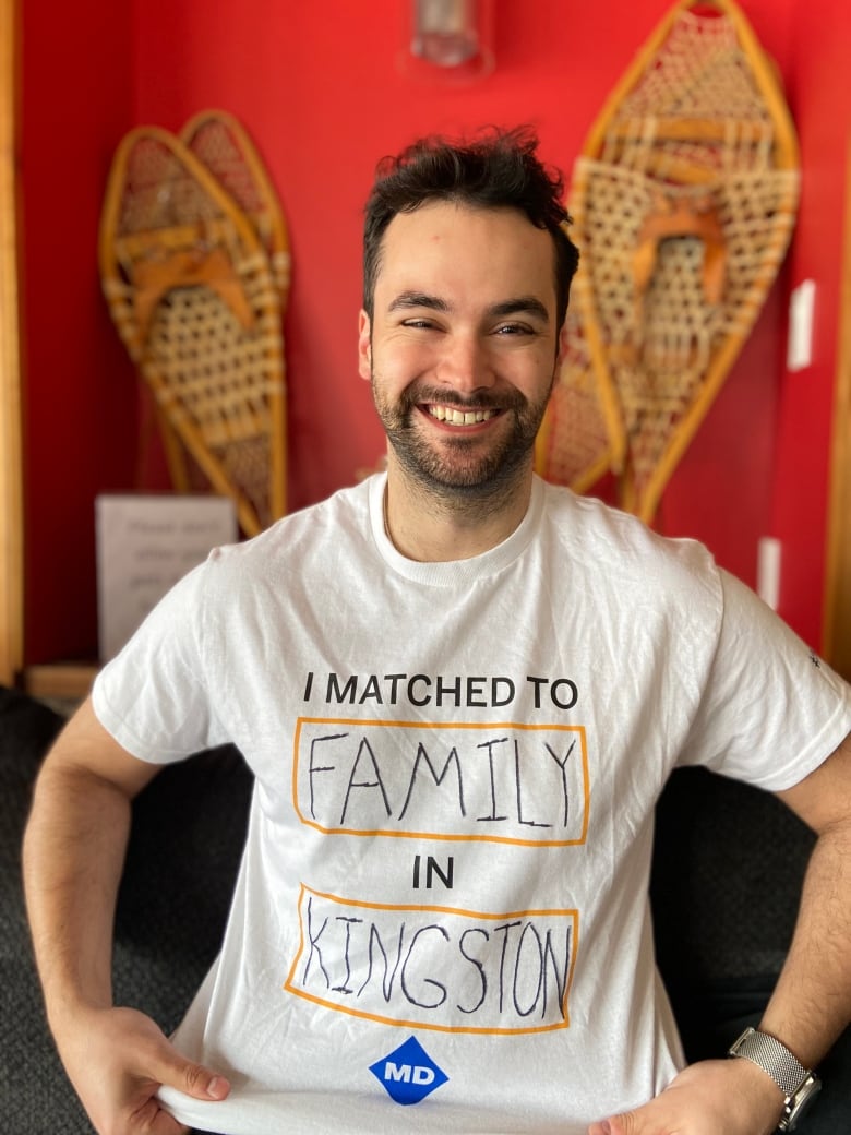 A person wears a t-shirt that says 'I matched to family in Kingston.'