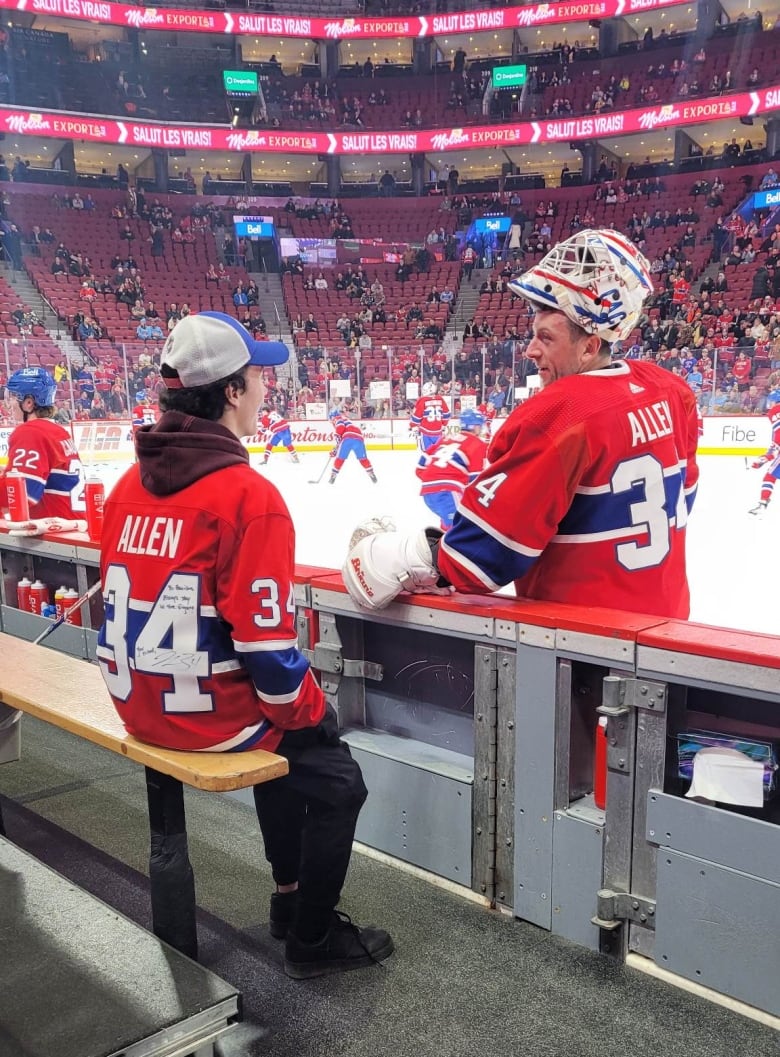Harrison sits at the bench at a Montreal Canadiens hockey game.