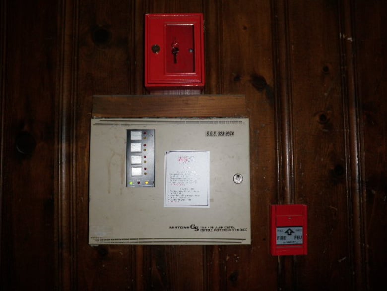 a view of a red fire alarm 