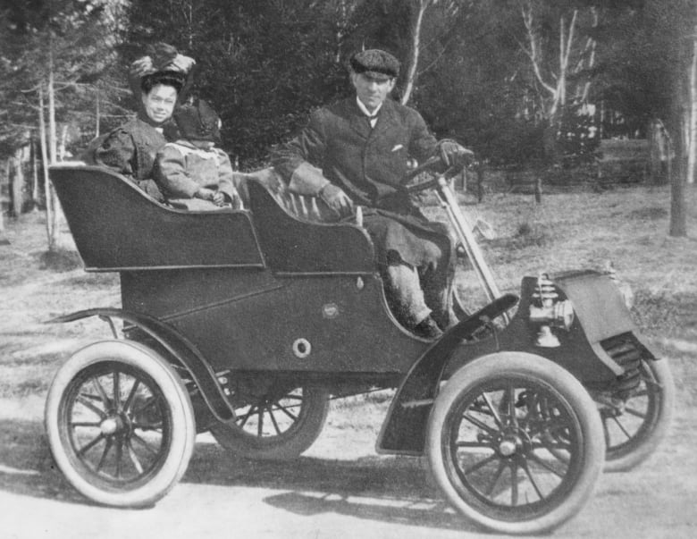 family in antique car 