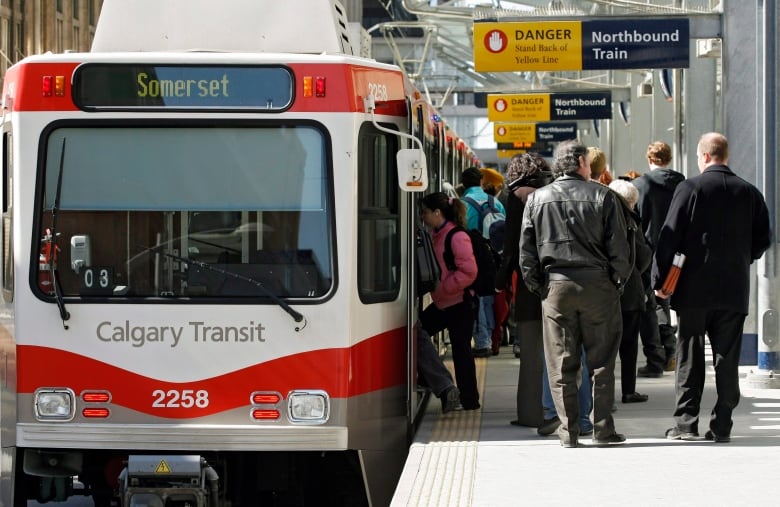 Passengers board a Calgary Ctrain.