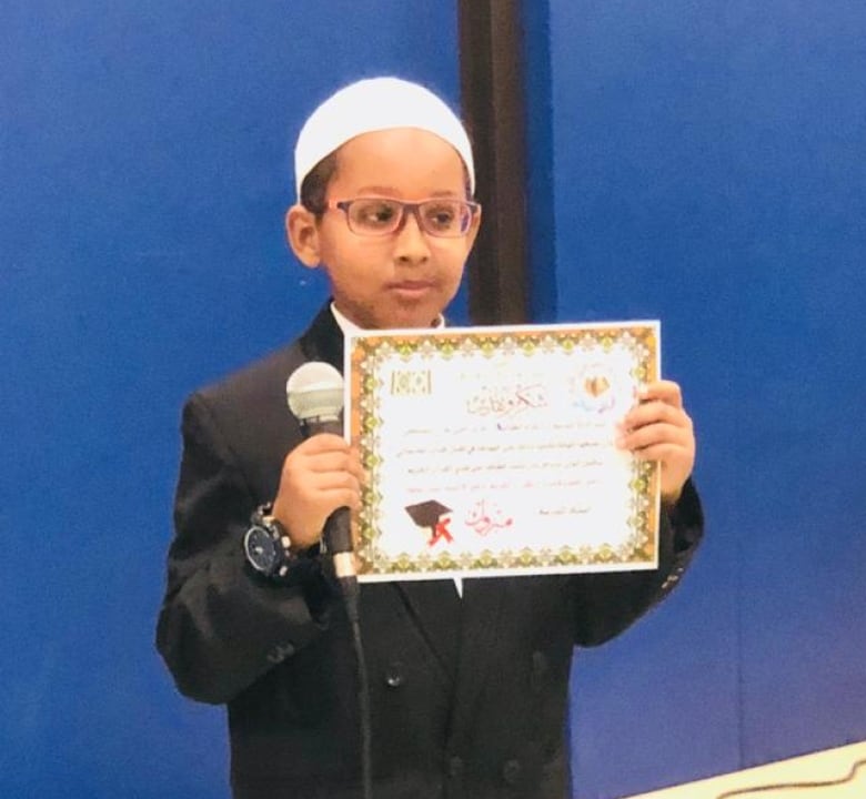 Boy holding a certificate
