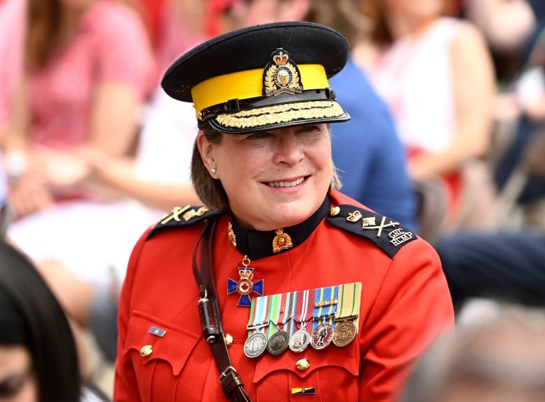 A woman police officer in red uniform