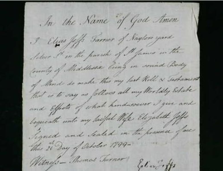A piece of paper with cursive writing on it describing a will.