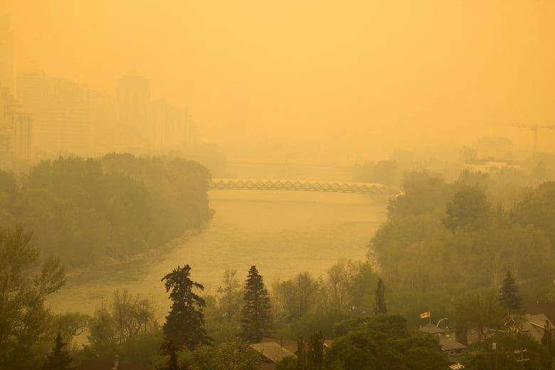 Smoke from northern Alberta forest fires blankets the Bow River area near downtown Calgary.
