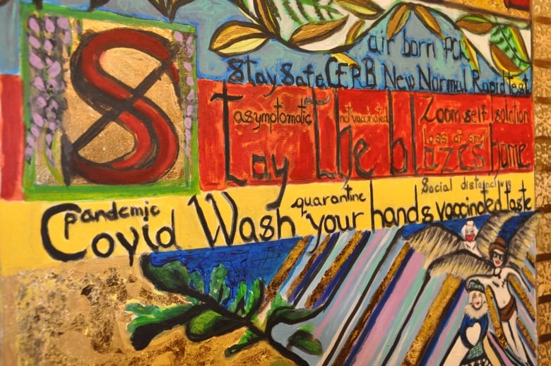 A painting with phrases such as 'Covid pandemic,' 'Wash your hands' and 'quarantine' is shown.