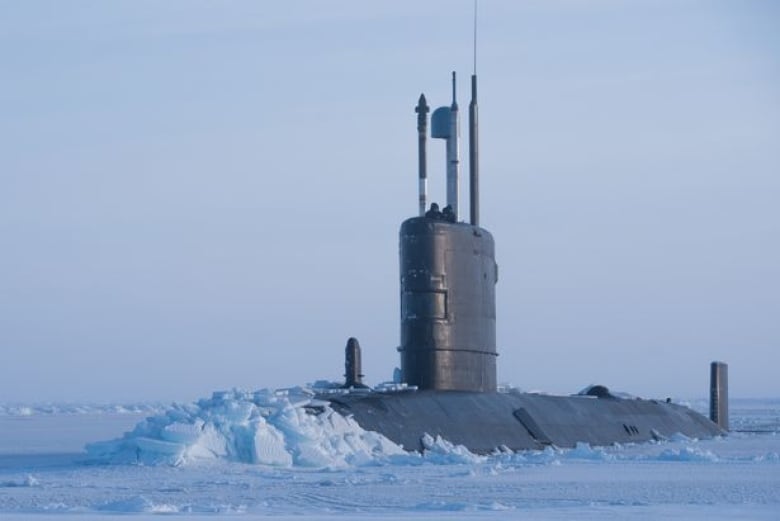A submarine breaks through Arctic ice.
