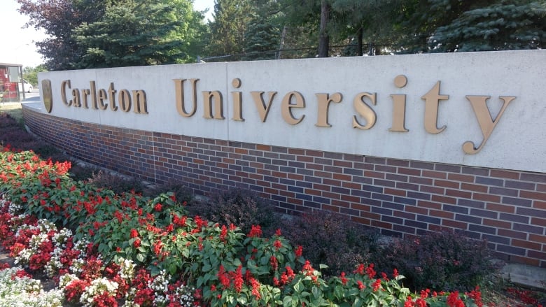 A sign for Carleton University at a campus entrance.
